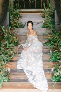 bride poses on stairs