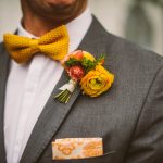 groom with yellow flowers