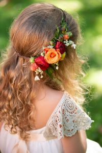 a girl with flowers in her hair